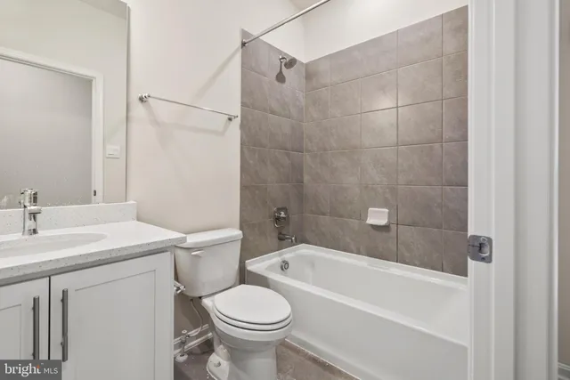 a bathroom with a sink a toilet and a bathtub