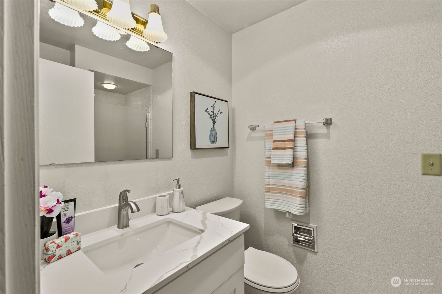 1633 Eagle Ridge Drive South, Unit A5 Renton, WA 98055 - Photo 15 of 25 a bathroom with a sink vanity mirror and toilet