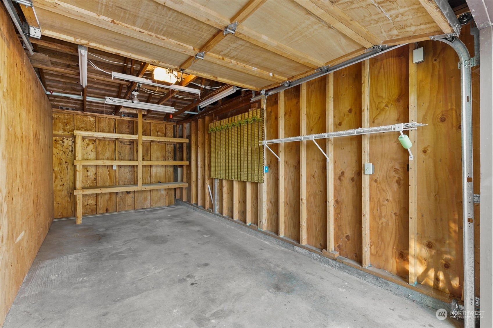 1633 Eagle Ridge Drive South, Unit A5 Renton, WA 98055 - Photo 19 of 25 a view of an empty room with wooden walls