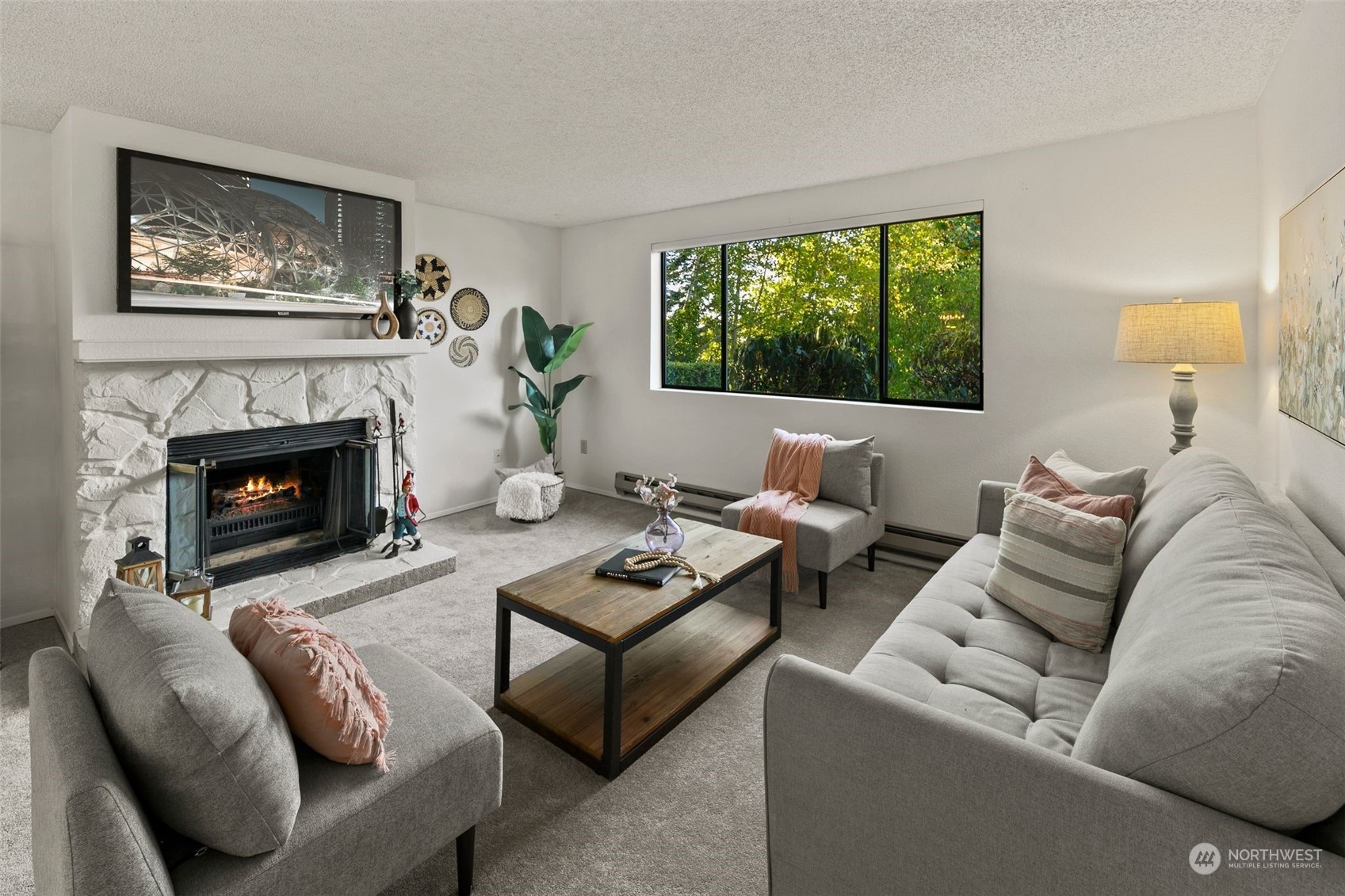 1633 Eagle Ridge Drive South, Unit A5 Renton, WA 98055 - Photo 2 of 25 a living room with furniture and a fireplace