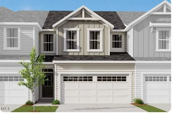 a front view of a house with a garage