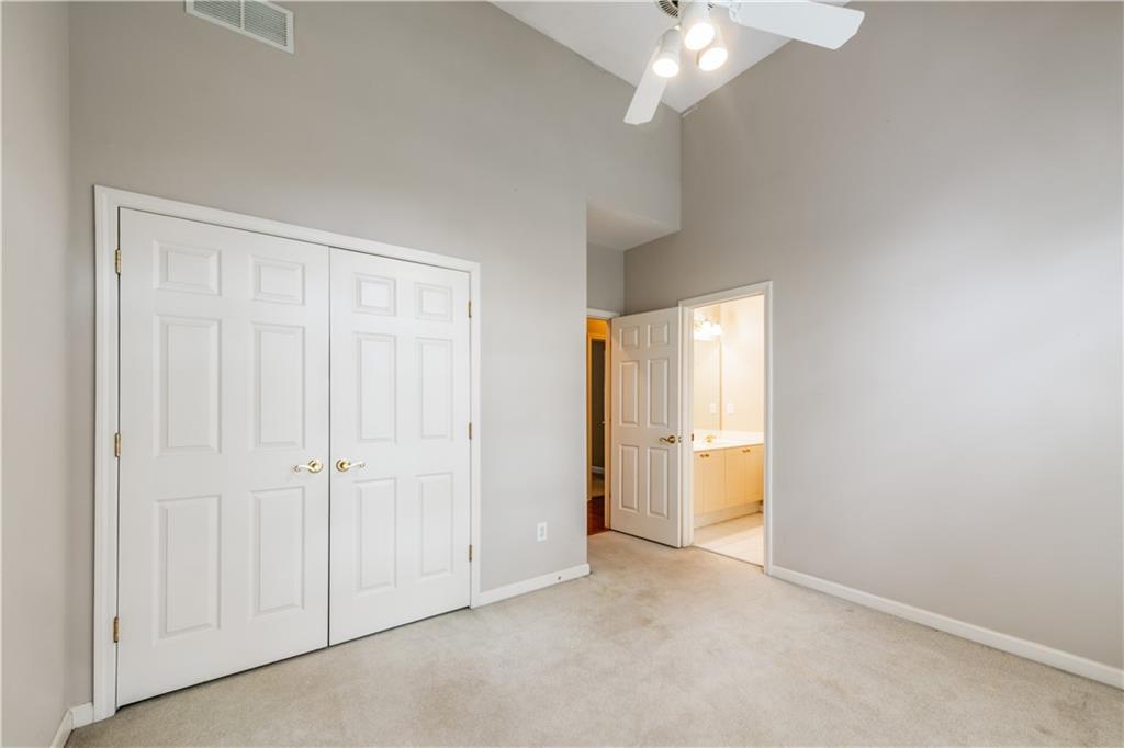 4924 Hugh Howell Road Stone Mountain, GA 30087 - Photo 16 of 42 an empty room with a bathroom