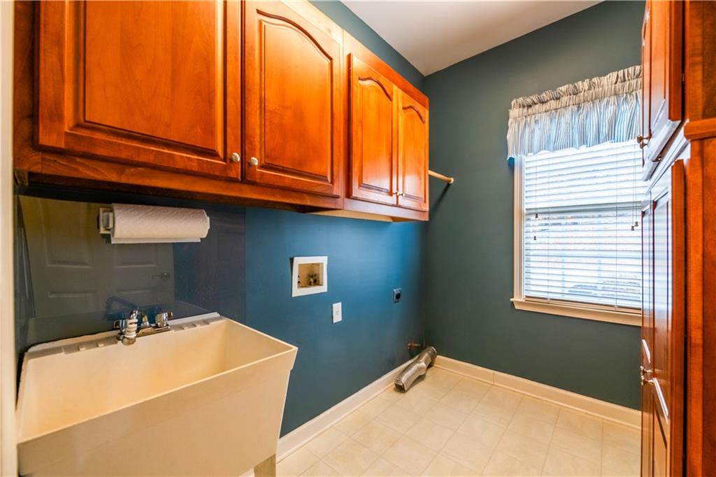 4924 Hugh Howell Road Stone Mountain, GA 30087 - Photo 27 of 42 a bathroom with a sink and a window