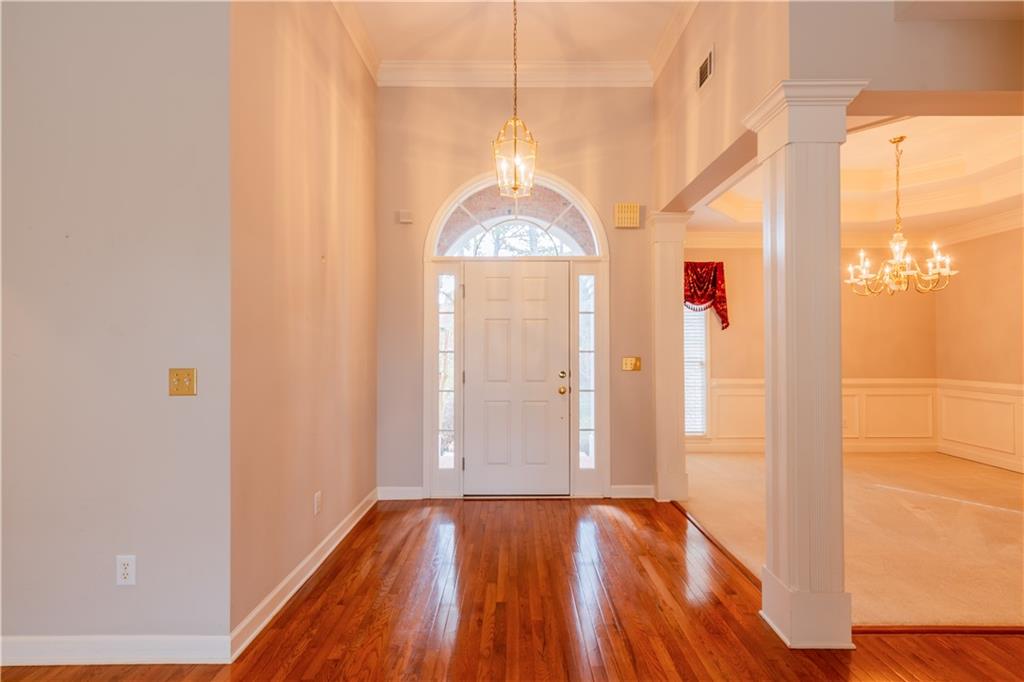 4924 Hugh Howell Road Stone Mountain, GA 30087 - Photo 3 of 42 a view of a room with wooden floor and windows