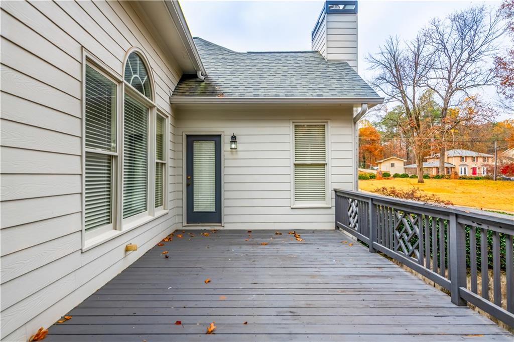 4924 Hugh Howell Road Stone Mountain, GA 30087 - Photo 35 of 42 a view of a wooden deck with a yard