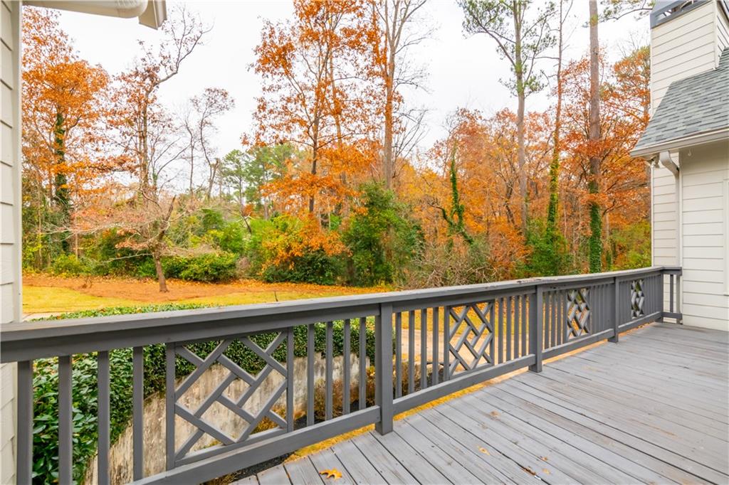 4924 Hugh Howell Road Stone Mountain, GA 30087 - Photo 37 of 42 a view of balcony with wooden floor and fence