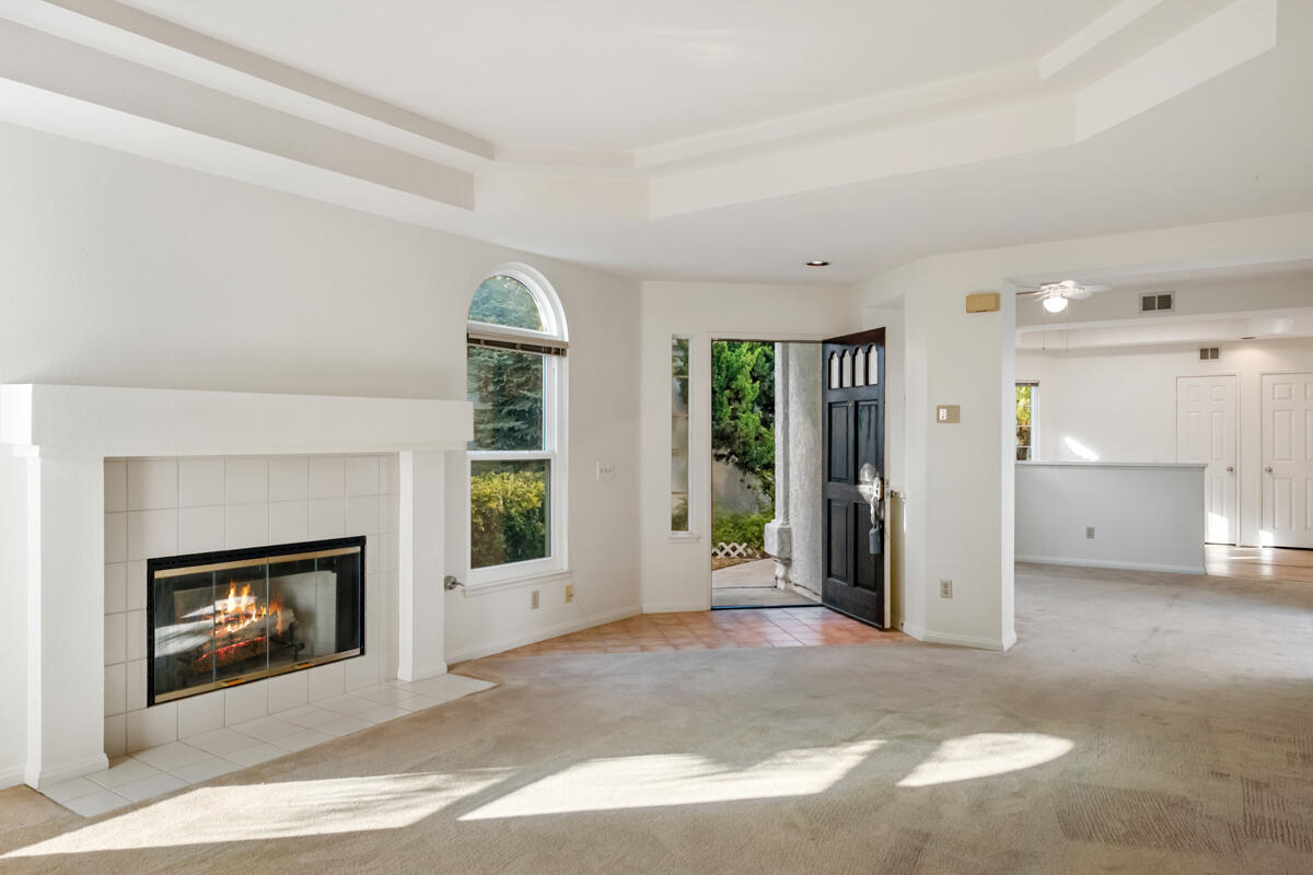 2110 Bermuda Dunes Place Oxnard, CA 93036 - Photo 11 of 43 a view of an empty room with a fireplace and a window