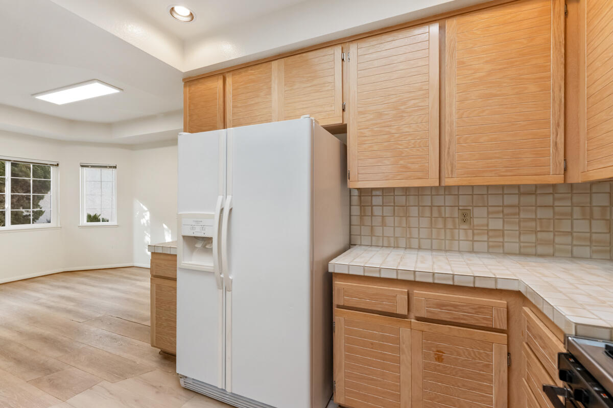 2110 Bermuda Dunes Place Oxnard, CA 93036 - Photo 18 of 43 a kitchen with a refrigerator and a sink