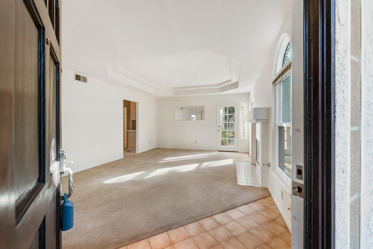 2110 Bermuda Dunes Place Oxnard, CA 93036 - Photo 20 of 43 a view of a hallway with wooden cabinet and a fireplace