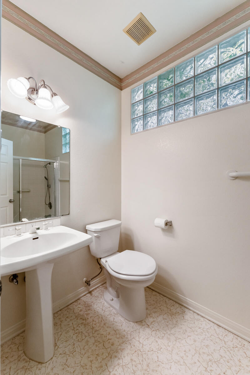 2110 Bermuda Dunes Place Oxnard, CA 93036 - Photo 25 of 43 a bathroom with a toilet sink and mirror