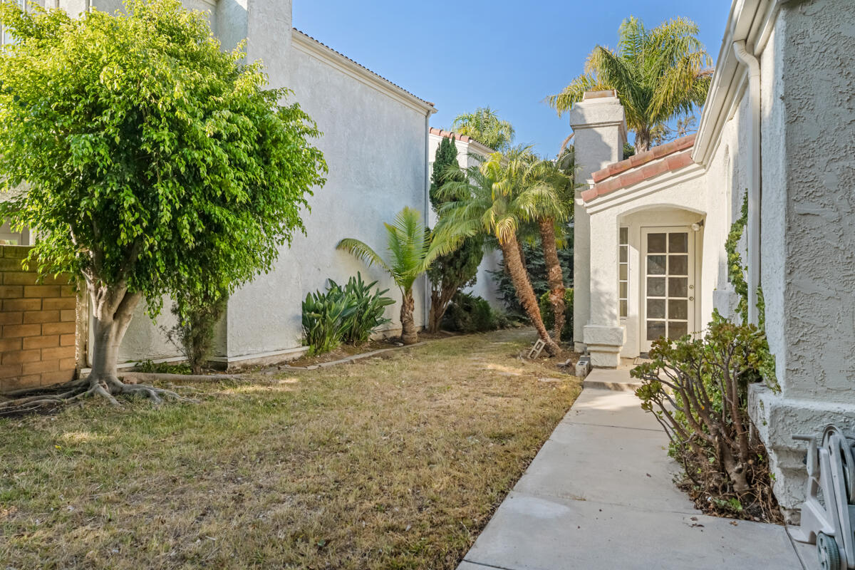 2110 Bermuda Dunes Place Oxnard, CA 93036 - Photo 29 of 43 a view of a house with a small yard and potted plants