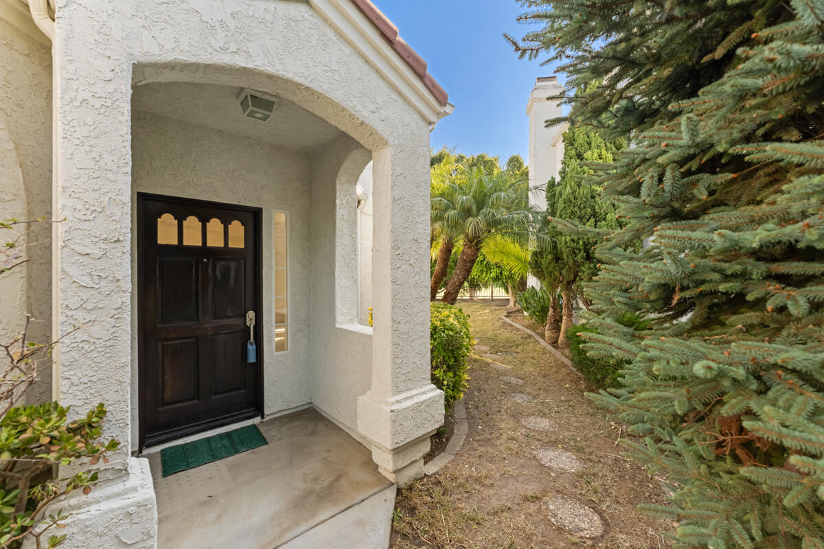 2110 Bermuda Dunes Place Oxnard, CA 93036 - Photo 5 of 43 a front view of a house with a yard