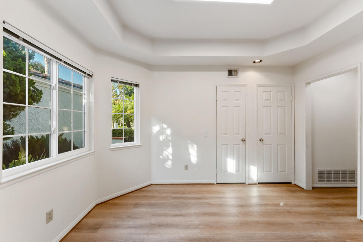 2110 Bermuda Dunes Place Oxnard, CA 93036 - Photo 7 of 43 a view of an empty room with wooden floor and windows