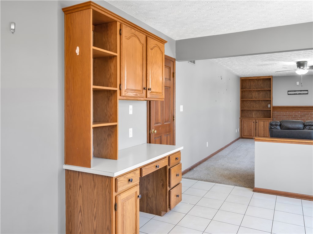 25 Callaway Springboro, OH 45066 - Photo 11 of 51 Functional built-in cabinetry provides storage and a dedicated workspace in this versatile interior.