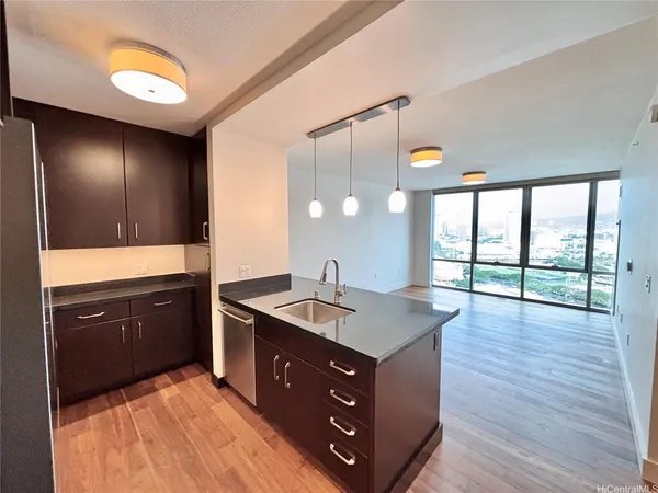 a spacious bathroom with a granite countertop sink and a large mirror