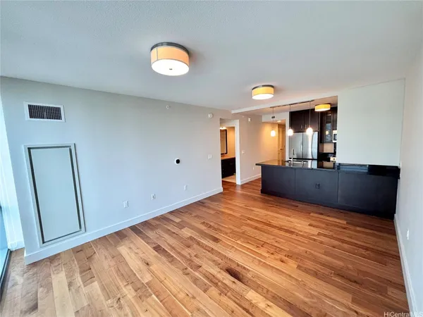a view of a kitchen from the hallway