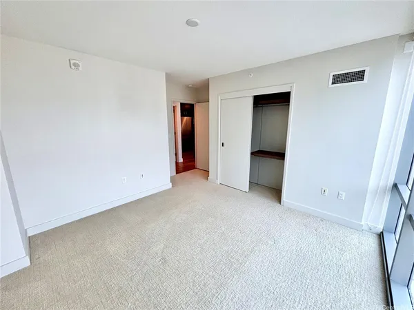 an empty room with a bathroom