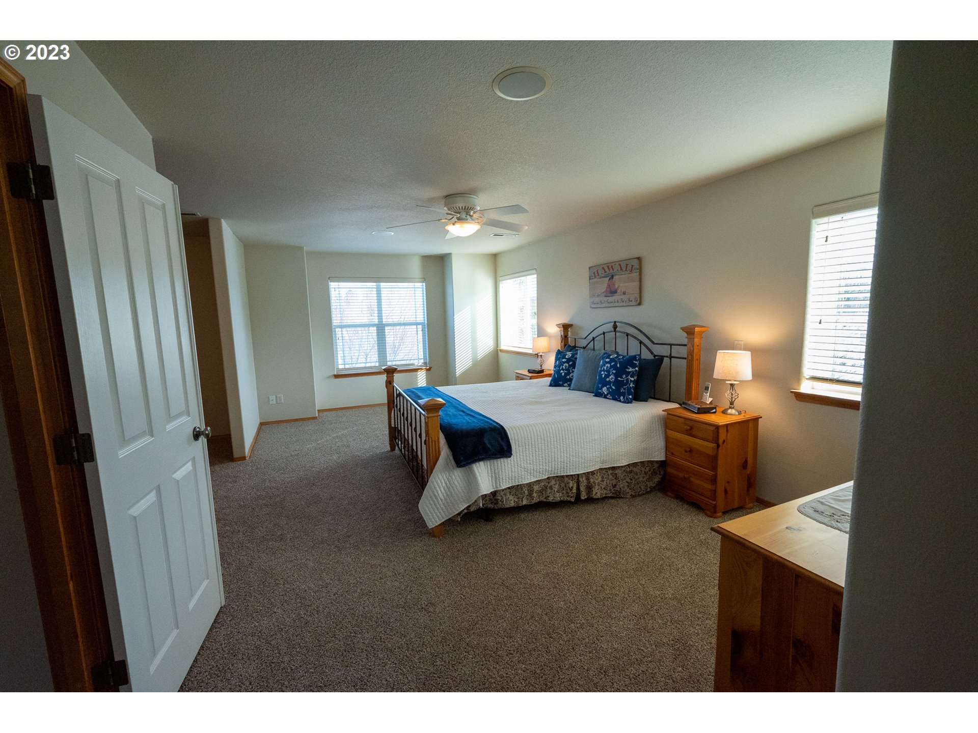 23891 Southwest Middleton Road Sherwood, OR 97140 - Photo 12 of 31 a spacious bedroom with a bed and window