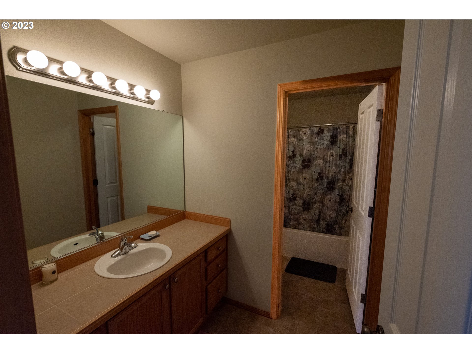 23891 Southwest Middleton Road Sherwood, OR 97140 - Photo 16 of 31 a bathroom with a sink and a mirror