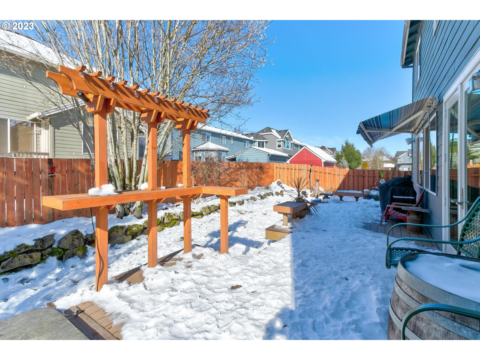 23891 Southwest Middleton Road Sherwood, OR 97140 - Photo 28 of 31 a view of a chairs and table in the backyard