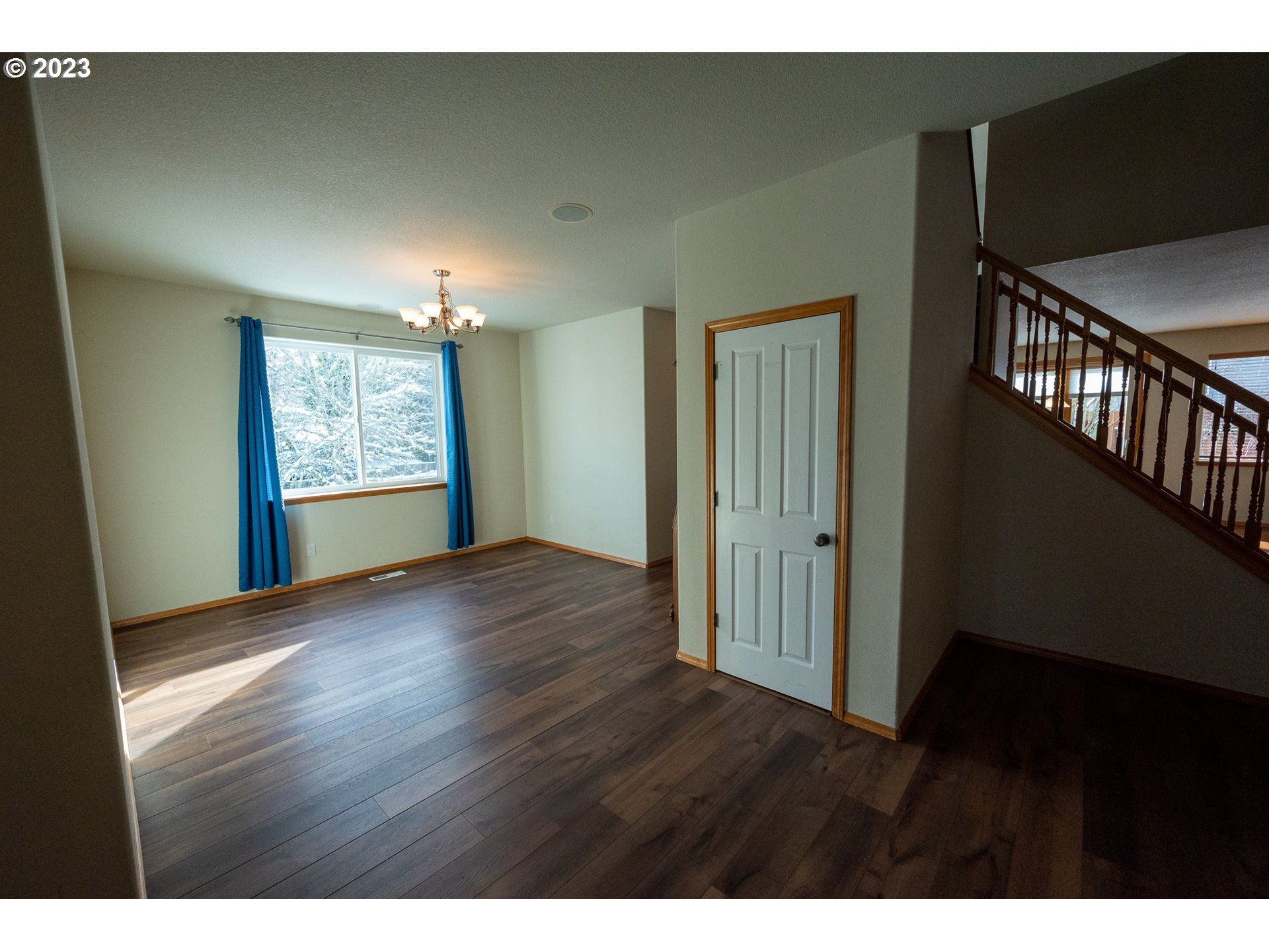 23891 Southwest Middleton Road Sherwood, OR 97140 - Photo 5 of 31 a view of an empty room with wooden floor and a window