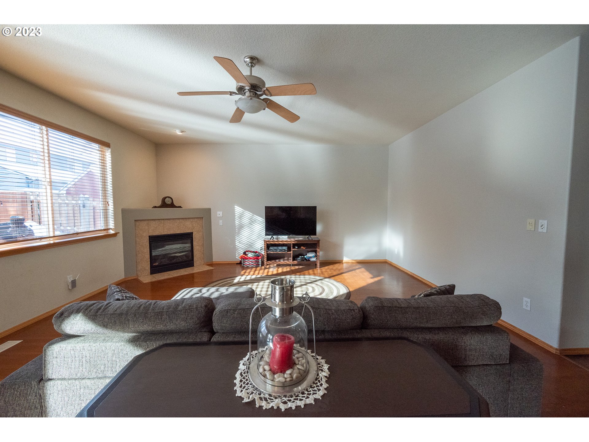 23891 Southwest Middleton Road Sherwood, OR 97140 - Photo 7 of 31 a bedroom with furniture and a fireplace
