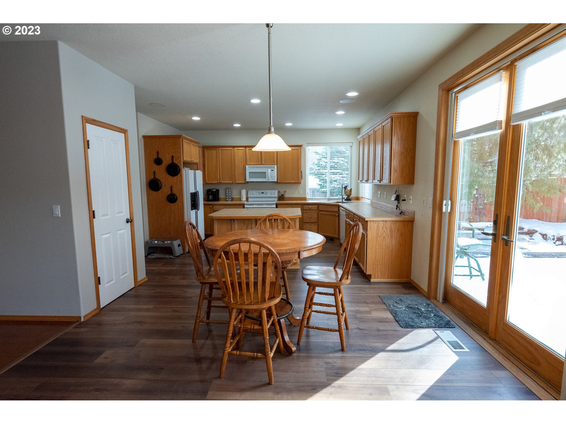 23891 Southwest Middleton Road Sherwood, OR 97140 - Photo 8 of 31 a view of a dining area with furniture window and wooden floor