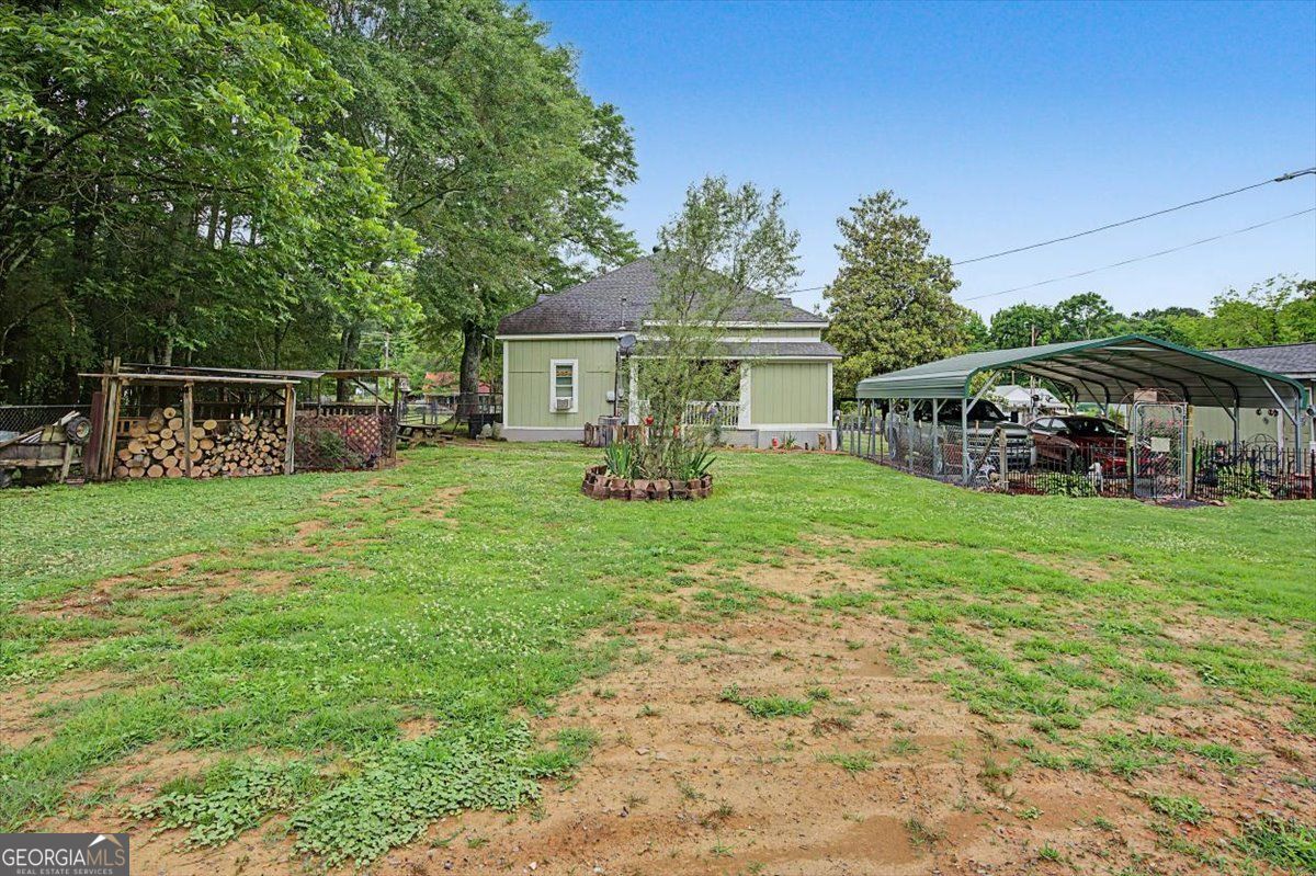 483 Coal Road Northwest Resaca, GA 30735 - Photo 50 of 56 a view of a house with a backyard porch and sitting area
