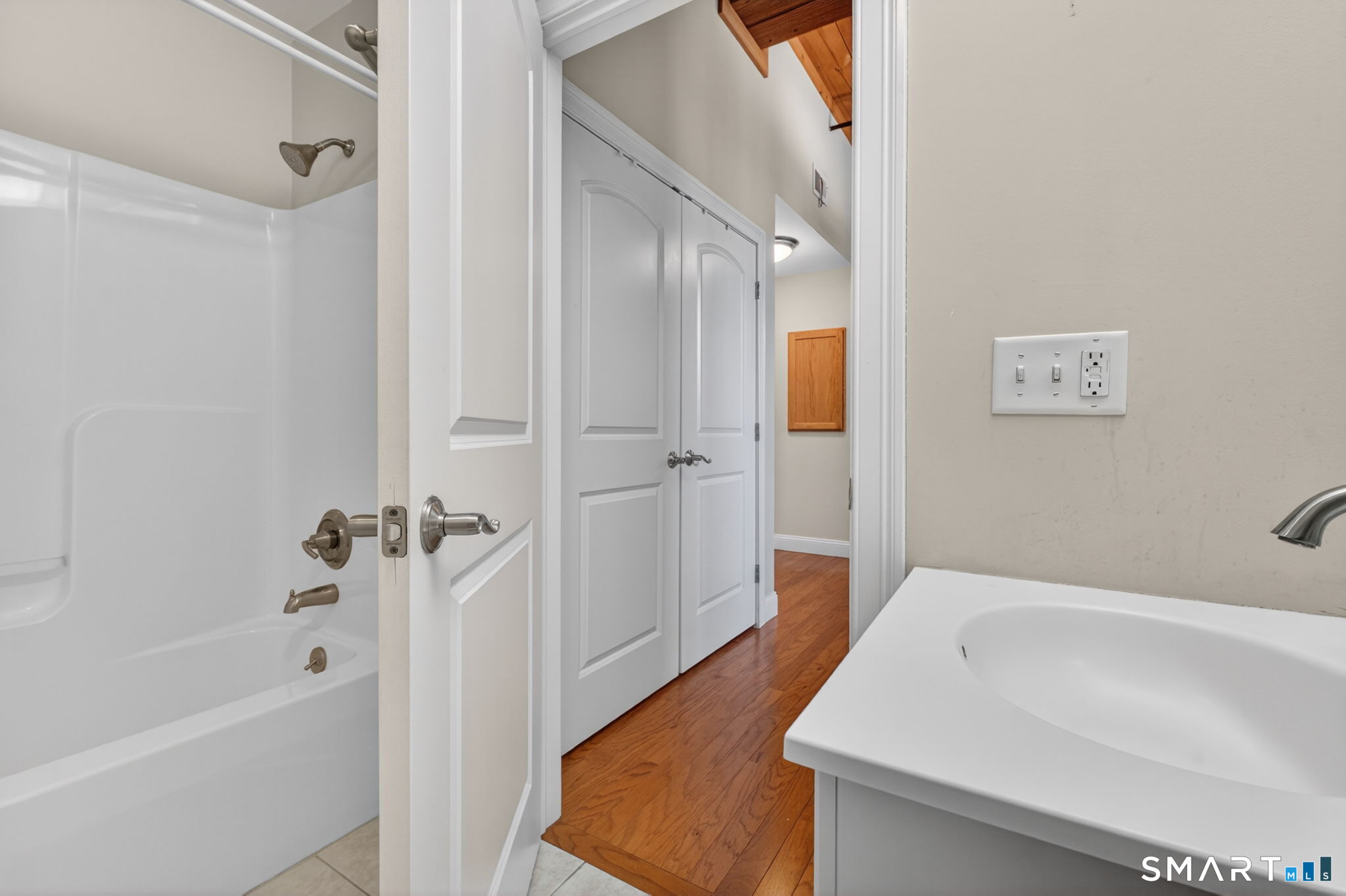 10 Main Street, Unit 102 Berlin, CT 06037 - Photo 11 of 28 a bathroom with a tub and shower