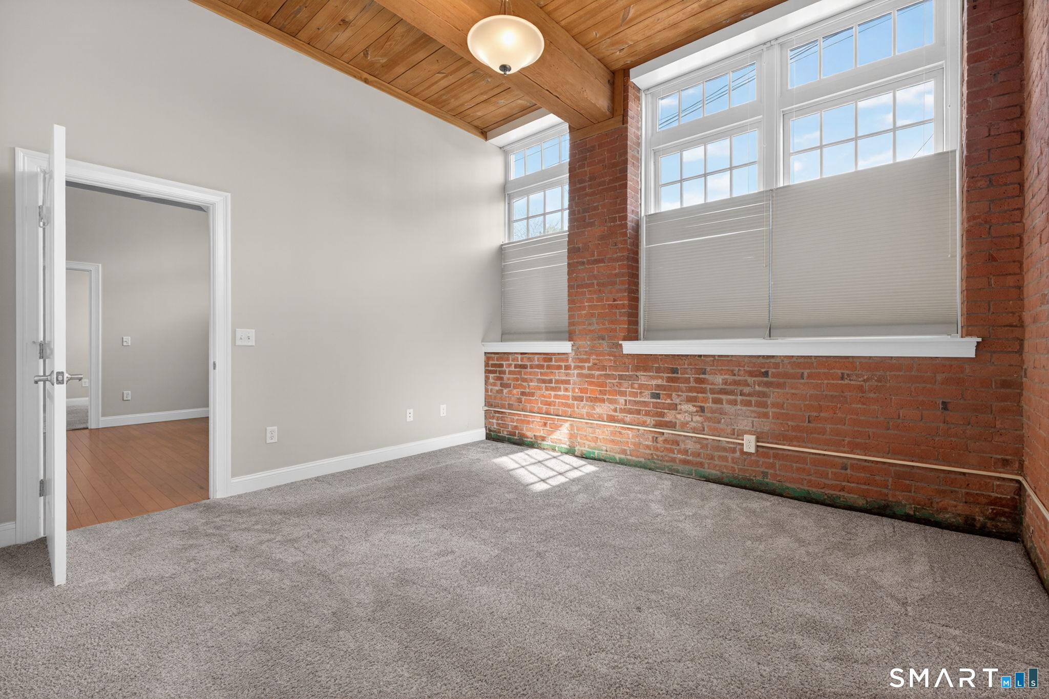 10 Main Street, Unit 102 Berlin, CT 06037 - Photo 14 of 28 a view of an empty room with a window