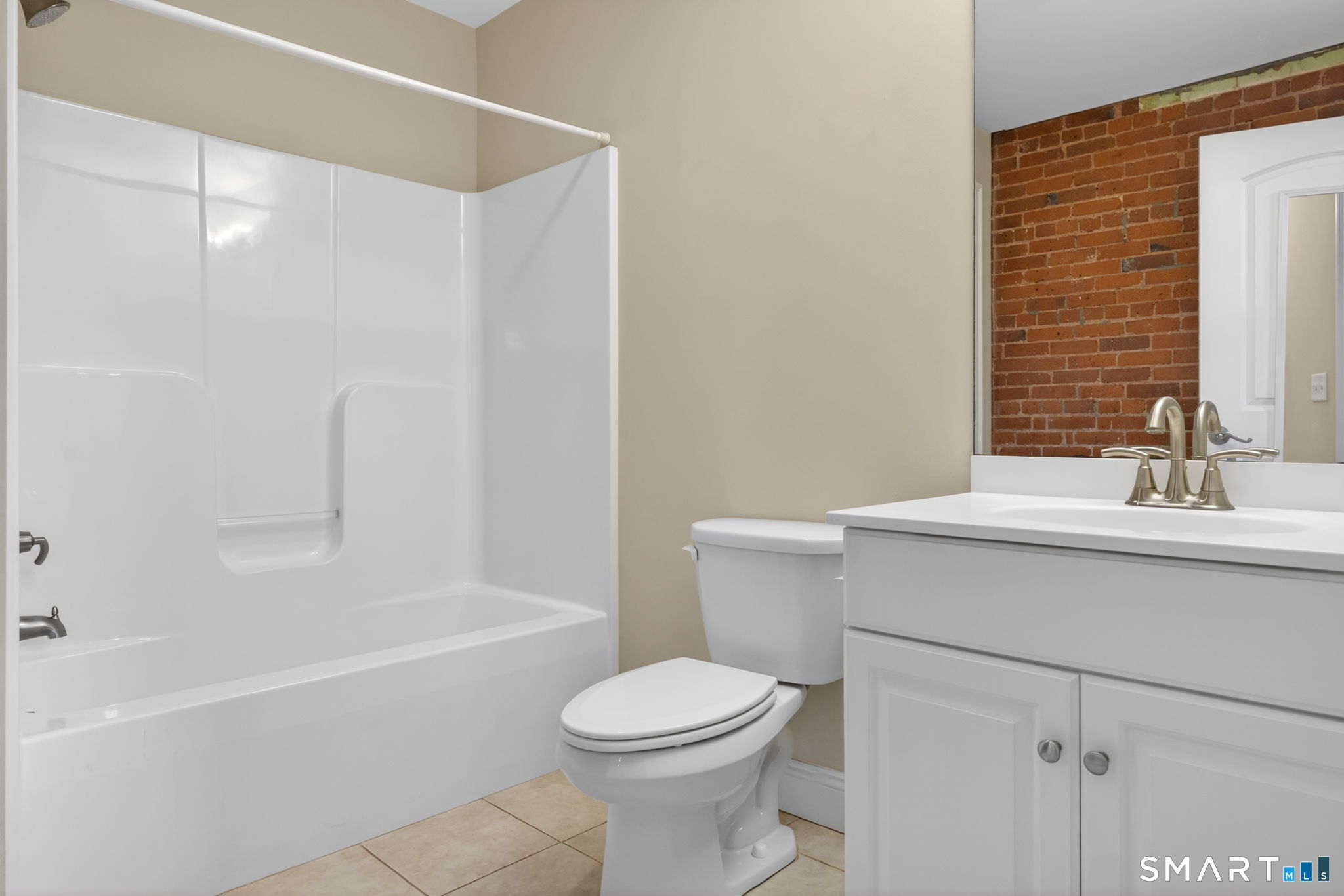 10 Main Street, Unit 102 Berlin, CT 06037 - Photo 15 of 28 a bathroom with a sink toilet and shower