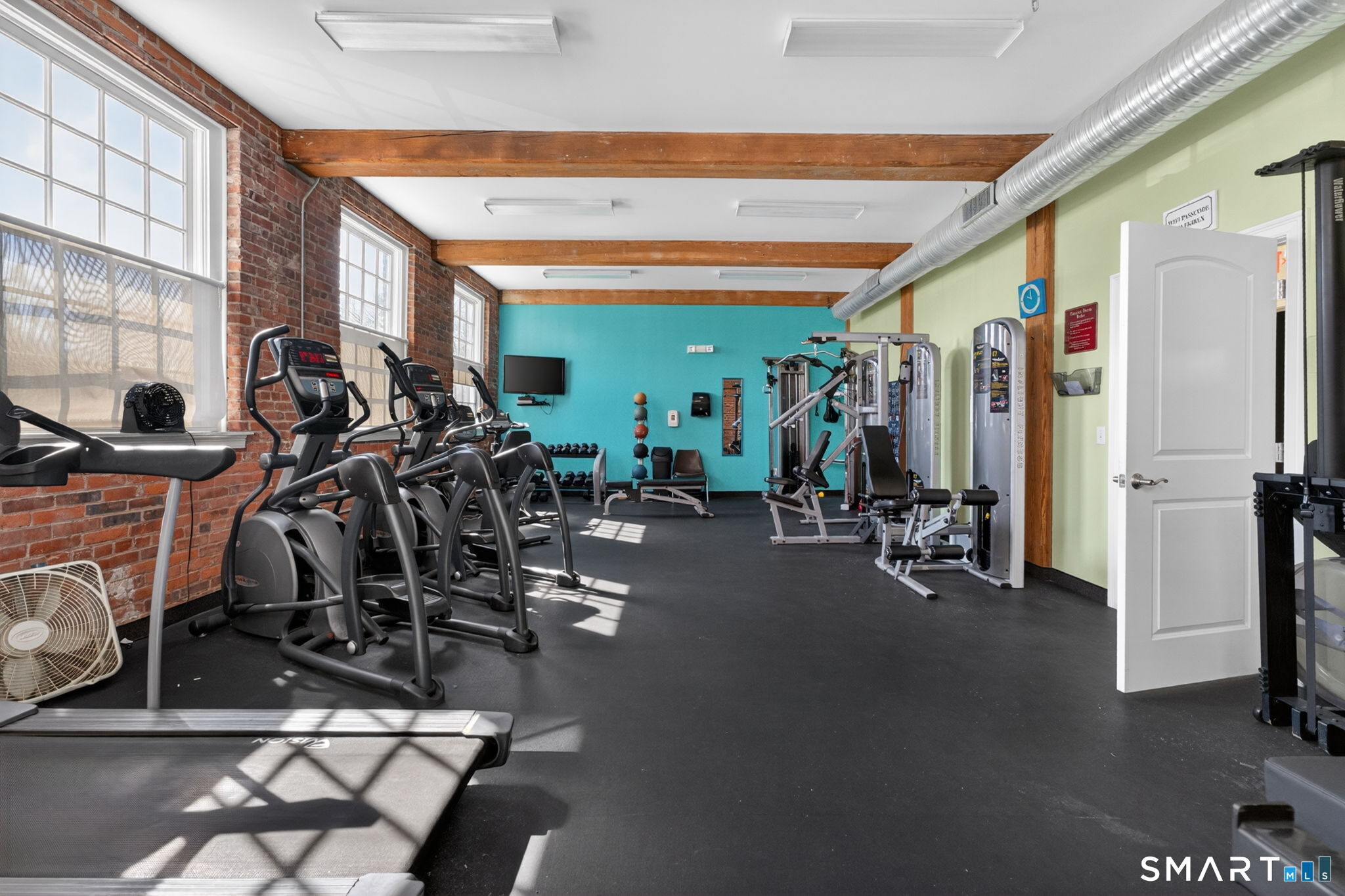 10 Main Street, Unit 102 Berlin, CT 06037 - Photo 19 of 28 a view of a room with gym equipment