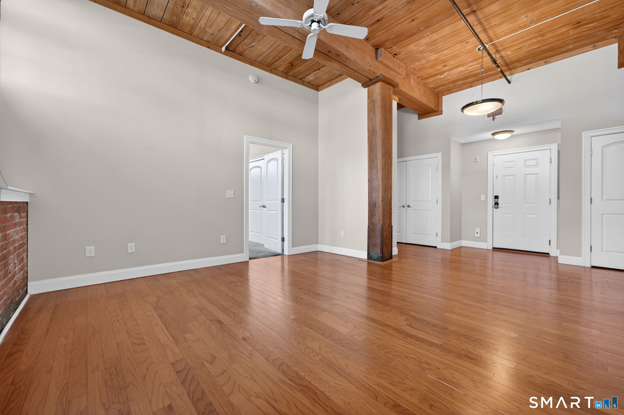10 Main Street, Unit 102 Berlin, CT 06037 - Photo 4 of 28 a view of a room with wooden floor and white walls