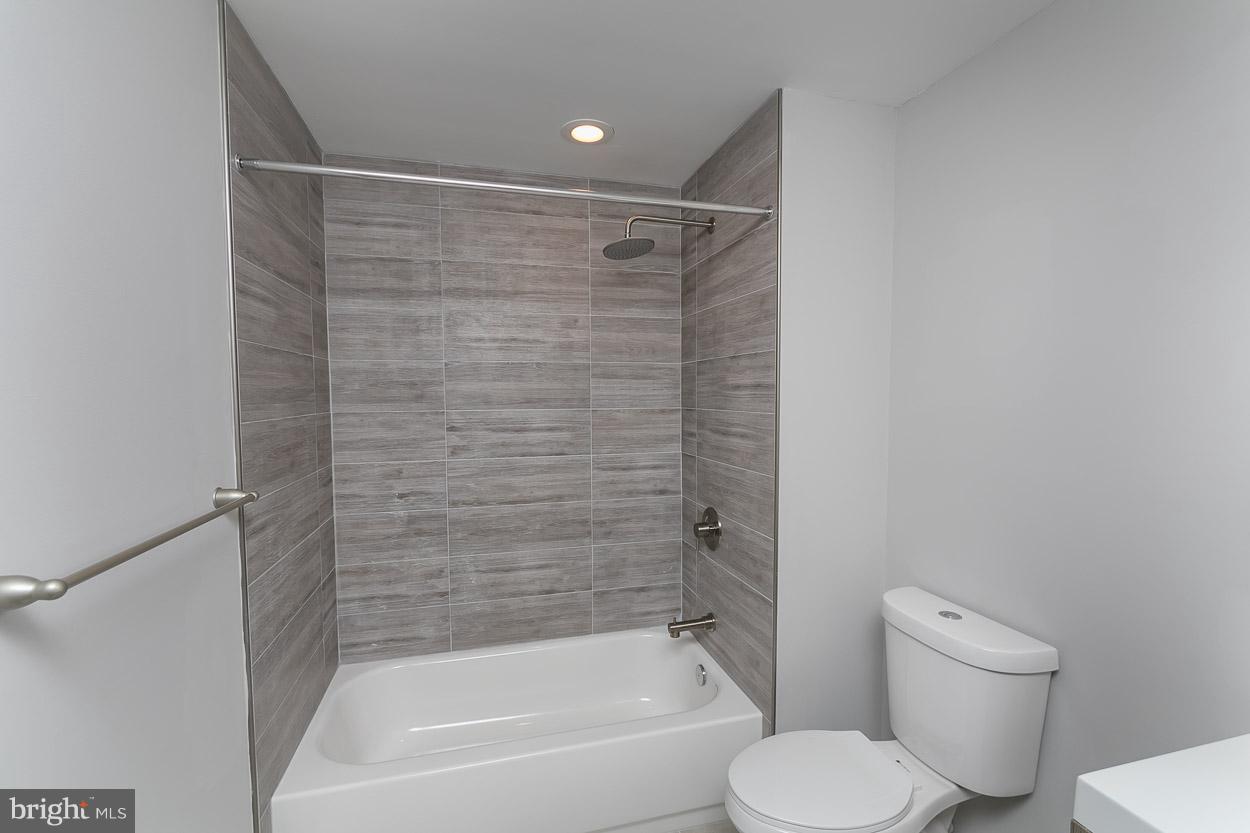 3601 Chapman Road Randallstown, MD 21133 - Photo 27 of 30 a bathroom with a toilet and a shower