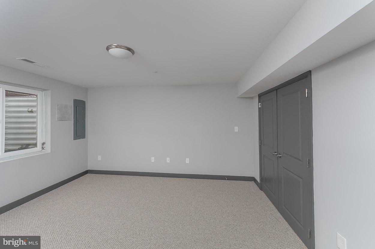 3601 Chapman Road Randallstown, MD 21133 - Photo 29 of 30 an empty room with a empty space and windows