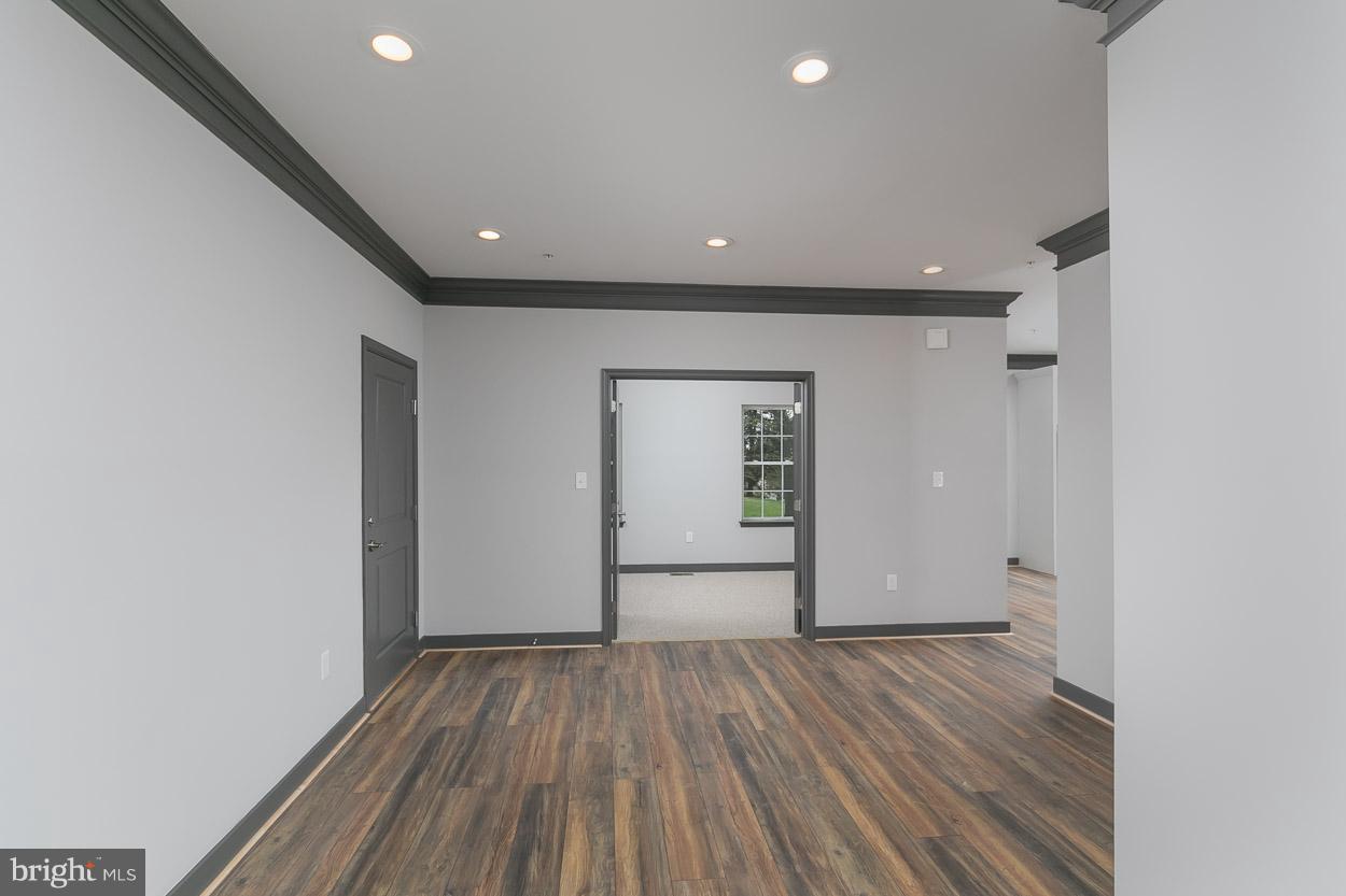 3601 Chapman Road Randallstown, MD 21133 - Photo 5 of 30 wooden floor in an empty room with wooden floor
