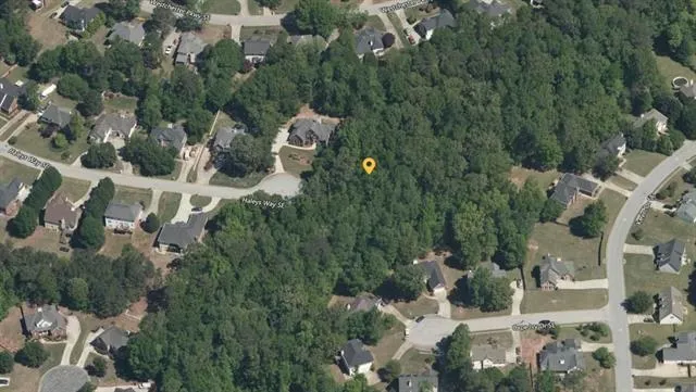 an aerial view of a house with yard