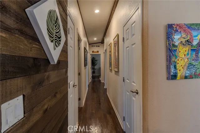 10550 Western, Unit 93 Stanton, CA 90680 - Photo 11 of 34 a view of a hallway with wooden floor and stairs