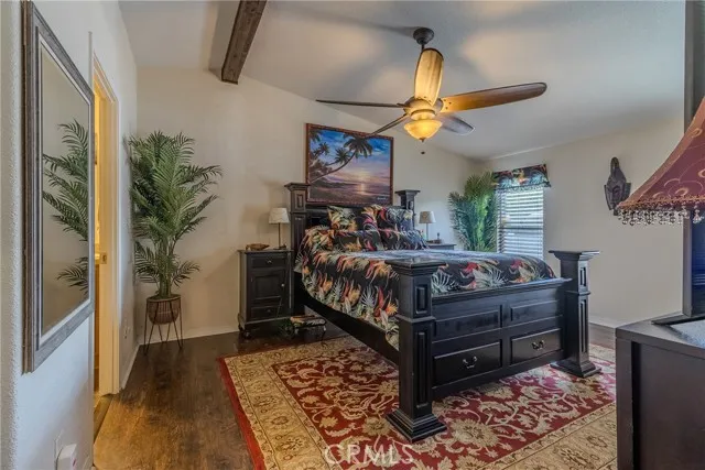 10550 Western, Unit 93 Stanton, CA 90680 - Photo 19 of 34 a bedroom with a bed and wooden floor