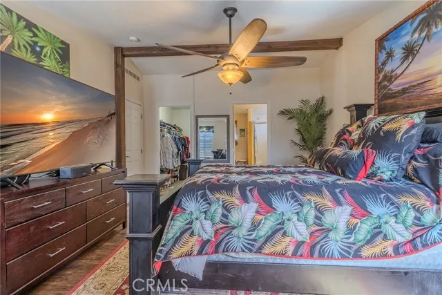 10550 Western, Unit 93 Stanton, CA 90680 - Photo 22 of 34 a bedroom with a bed and ceiling fan