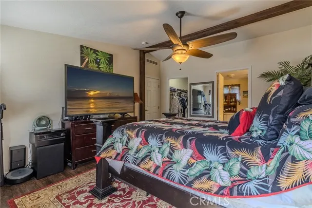 10550 Western, Unit 93 Stanton, CA 90680 - Photo 24 of 34 a bedroom with a bed and a flat screen tv