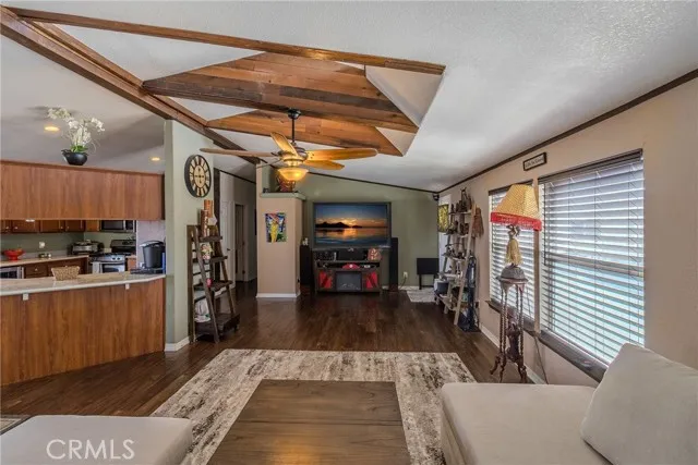 10550 Western, Unit 93 Stanton, CA 90680 - Photo 4 of 34 a living room with stainless steel appliances furniture a rug and a view of kitchen