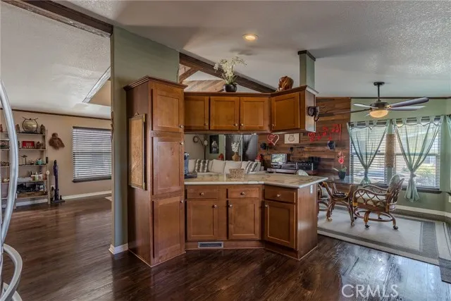 10550 Western, Unit 93 Stanton, CA 90680 - Photo 9 of 34 a kitchen with stainless steel appliances granite countertop a stove and wooden floors