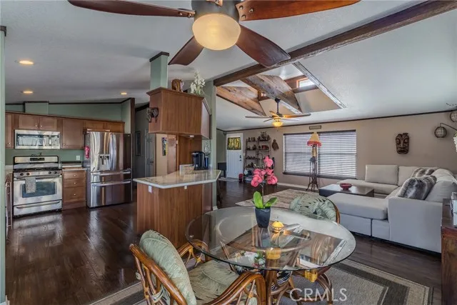 10550 Western, Unit 93 Stanton, CA 90680 - Photo 10 of 34 a living room with lots of furniture and kitchen view