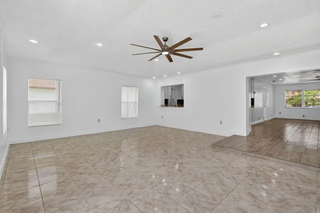 a view of a livingroom with a microwave and a floor to ceiling window