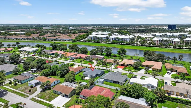 an aerial view of multiple houses with yard