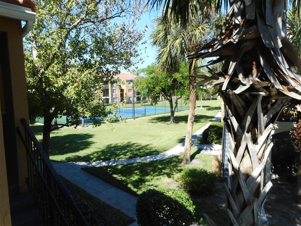 7970 North Nob Hill Road, Unit 207 Tamarac, FL 33321 - Photo 12 of 22 a view of yard with tree in it