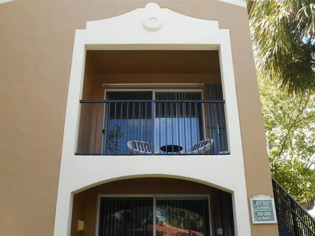 a view of a chairs and table in patio