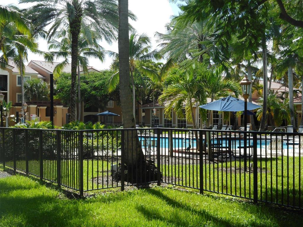 7970 North Nob Hill Road, Unit 207 Tamarac, FL 33321 - Photo 16 of 22 a view of a wrought iron fences in front of house