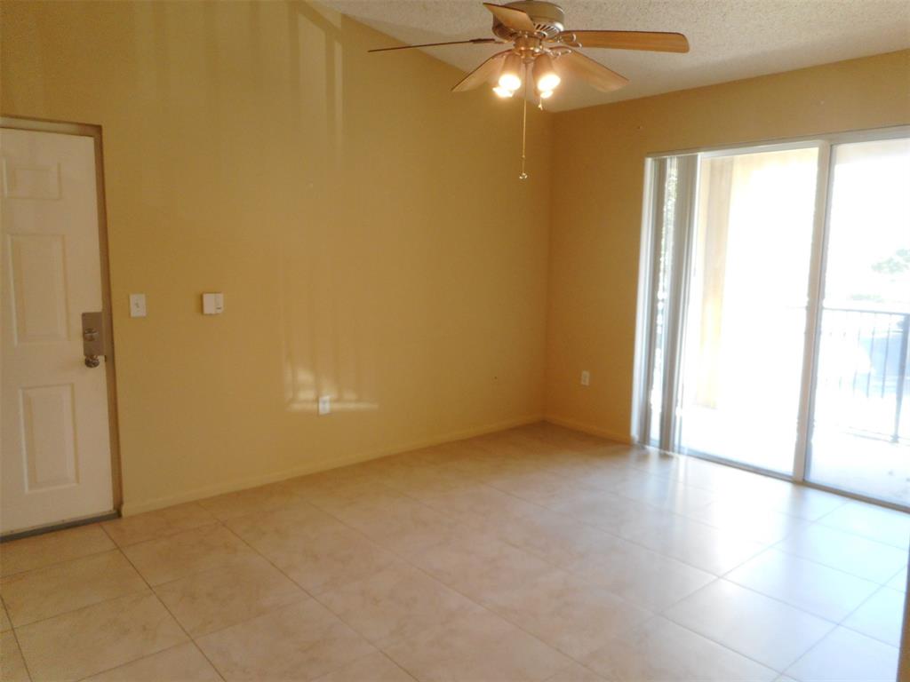 7970 North Nob Hill Road, Unit 207 Tamarac, FL 33321 - Photo 6 of 22 an empty room with a empty space and a window